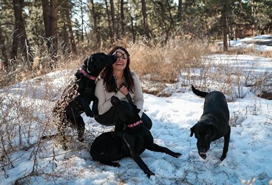 Dr. Cindy with dogs outside